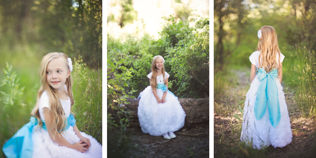 girls in white dresses with blue satin sashes